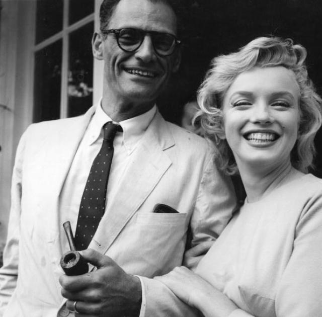 American film star Marilyn Monroe (1926 - 1962) outside her home in Englefield Green with her third husband American playwright Arthur Miller. Original Publication: People Disc - HN0485 (Photo by Evening Standard/Getty Images)